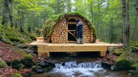 A Man Builds a Secret Shelter in the Forest Above the Stream
